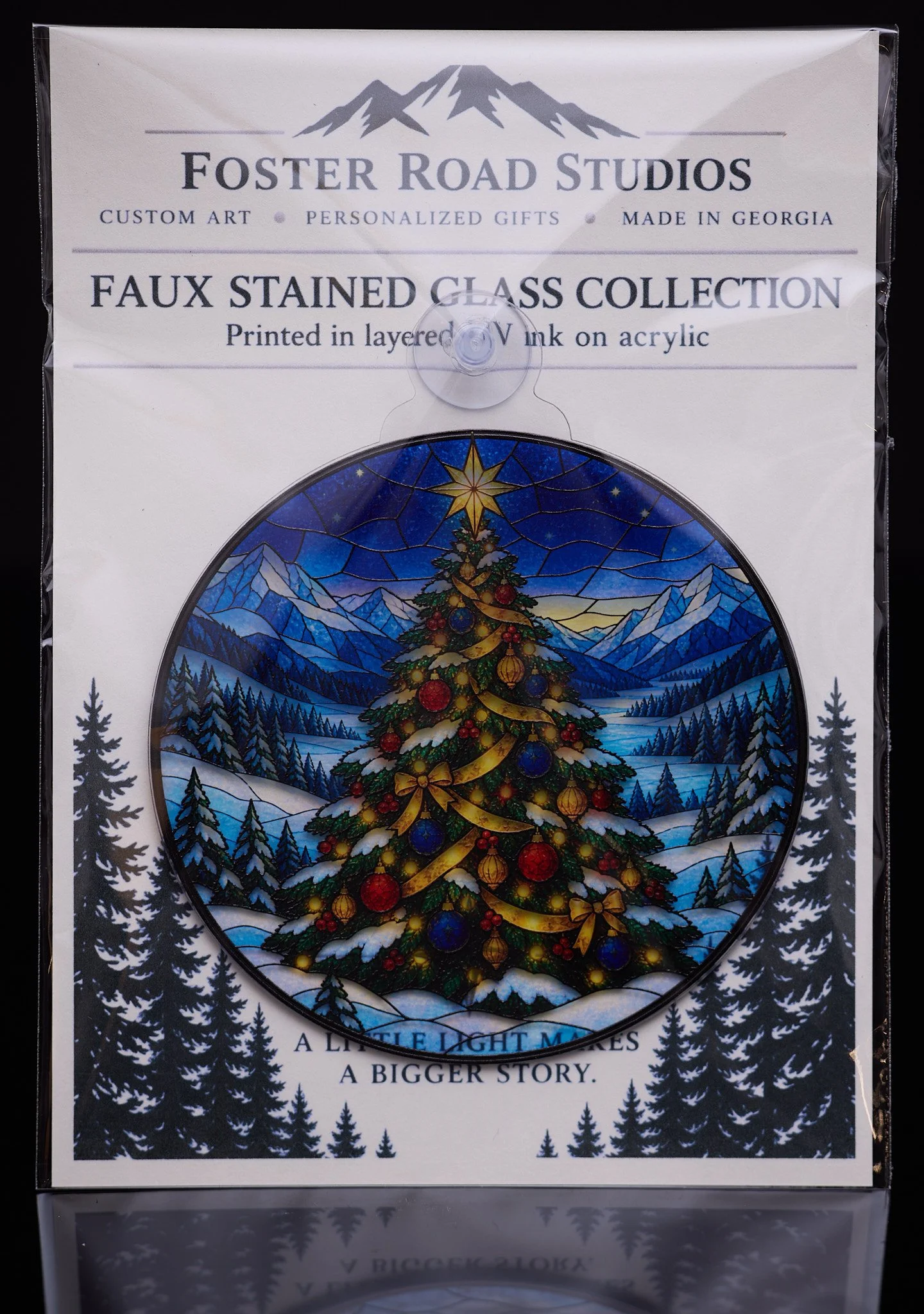 Faux stained glass Christmas ornament — colorful acrylic art in Foster Road Studios packaging.