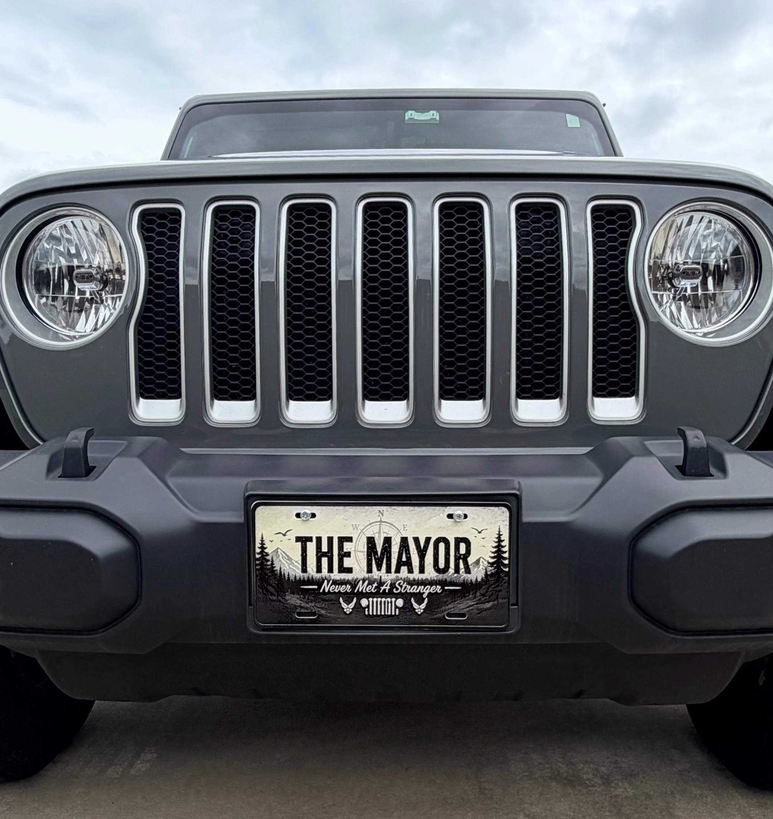 The Mayor — a custom decorative front license plate that adds personality to the adventure. Designs available by request.