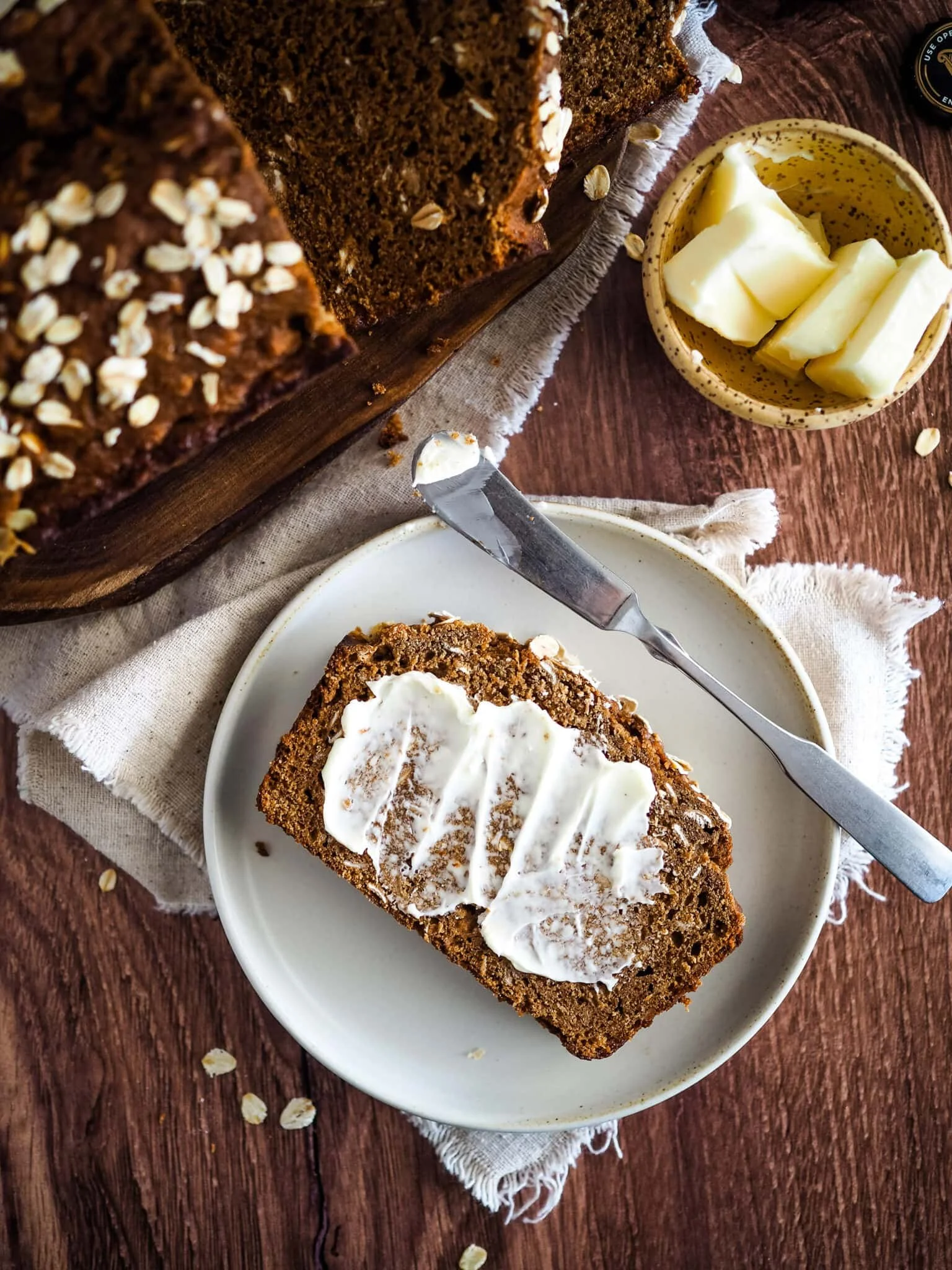 Home baked brown bread with butter and jam. Toast and french press coffee.