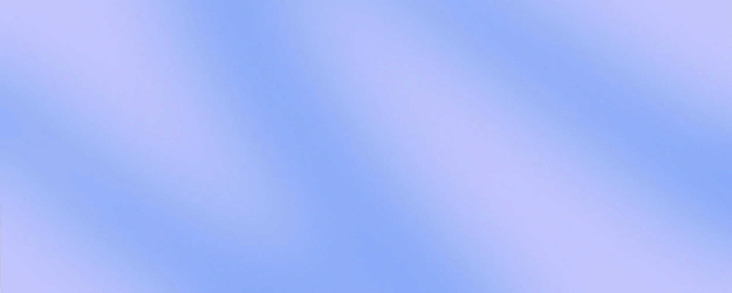 A blue sky with a few soft, scattered clouds.
