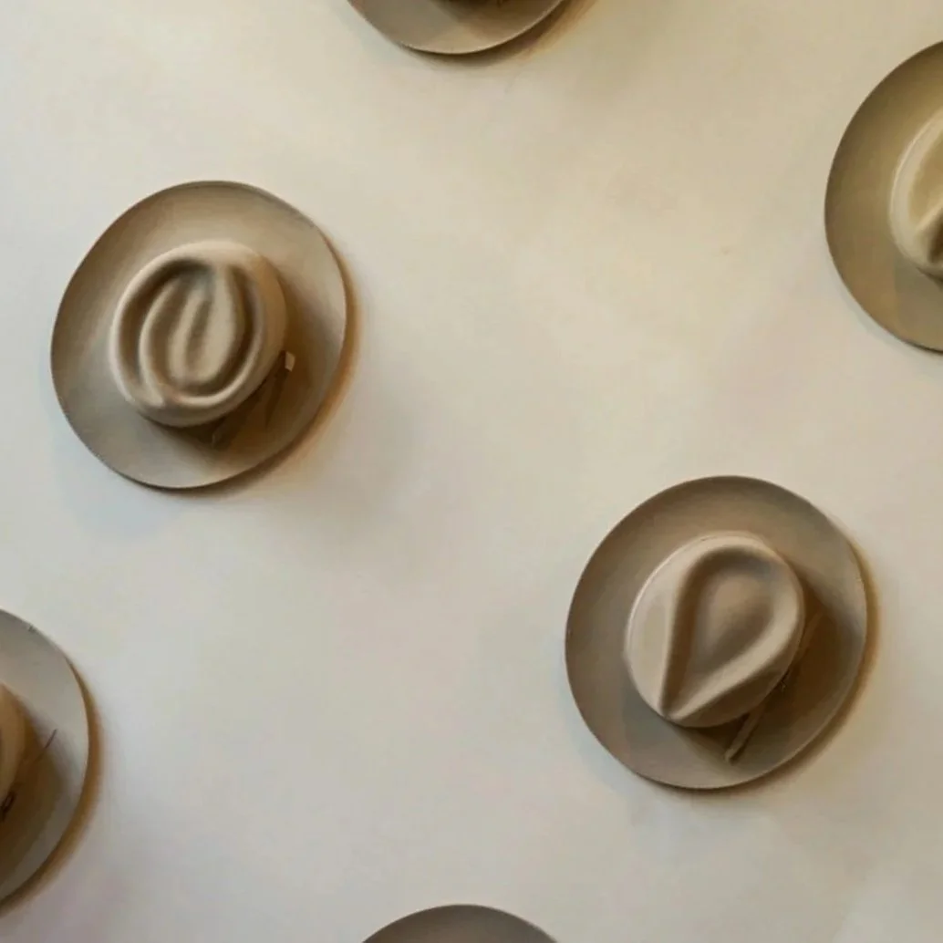 Geometric drawing of an outline square with sections divided by vertical, horizontal, and diagonal lines.