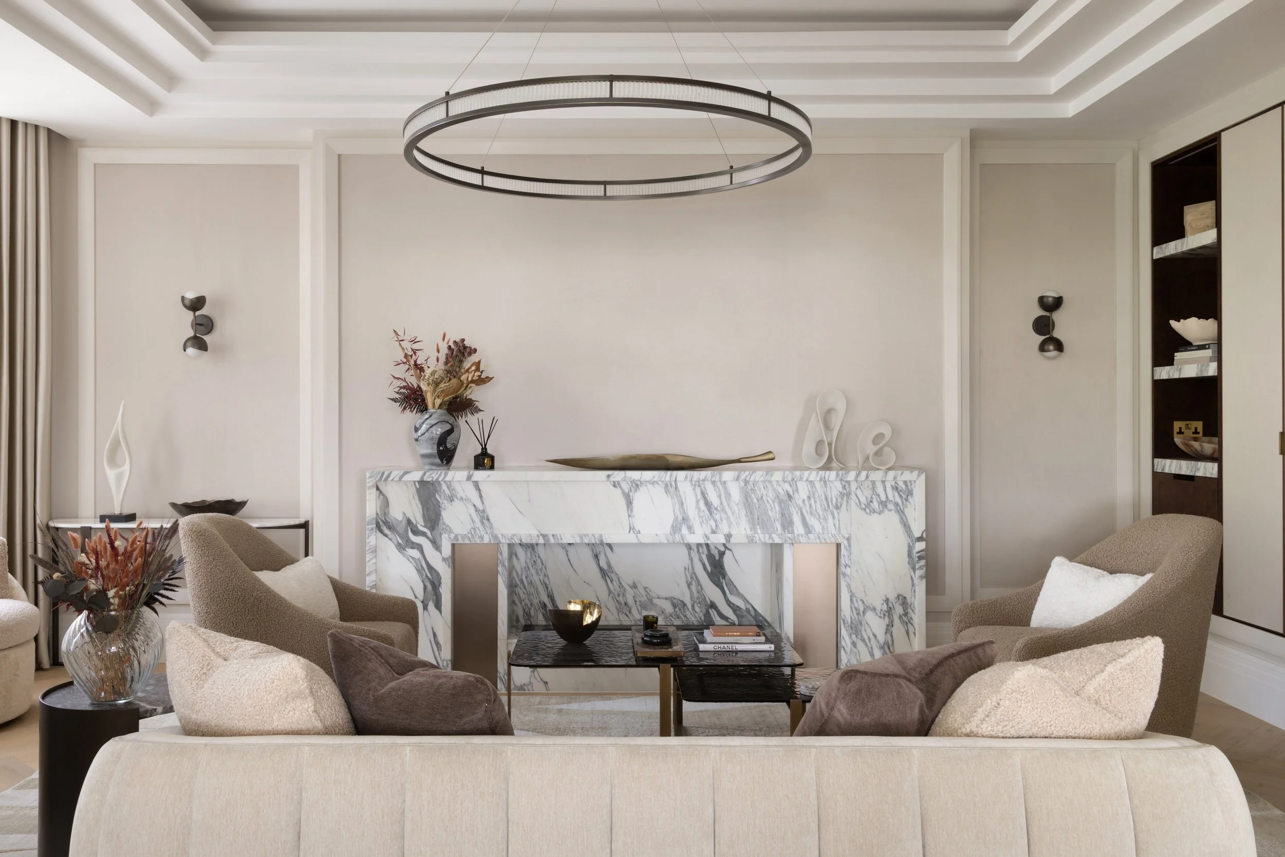 From the formal lounge, bespoke sliding doors lead into the more relaxed family living space, where a generously proportioned bespoke chaise takes centre stage.

This was a particularly challenging room to balance, and I explored several different la
