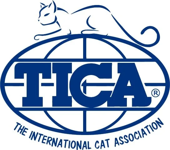 Logo of The International Cat Association featuring a stylized cat atop an oval globe with the acronym TICA written inside, and the organization's full name curved below.