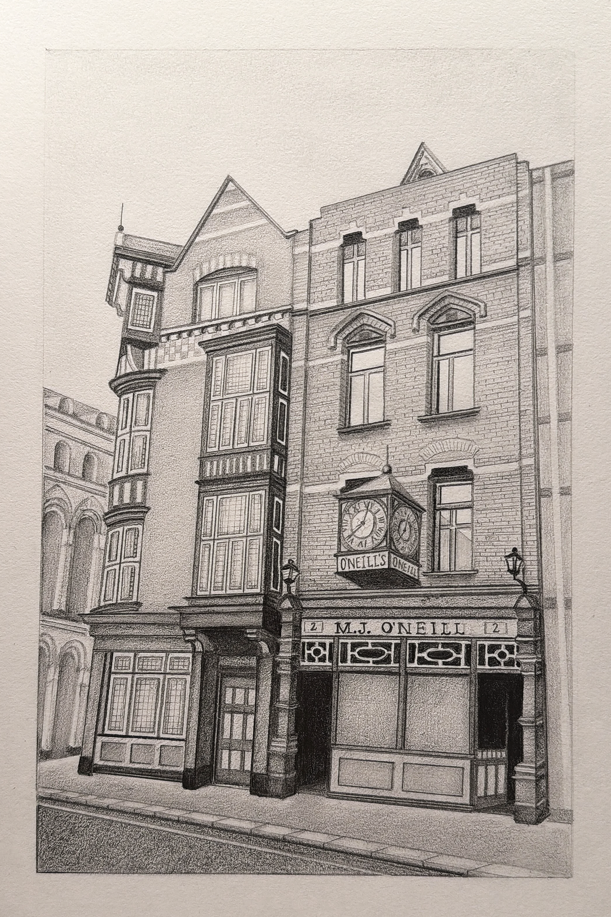 A black-and-white sketch of a historic multi-story building with detailed brickwork, ornate window frames, and a prominent clock on the facade. The building has a classic architectural style with decorative elements and a sign reading "O'Neill's."
