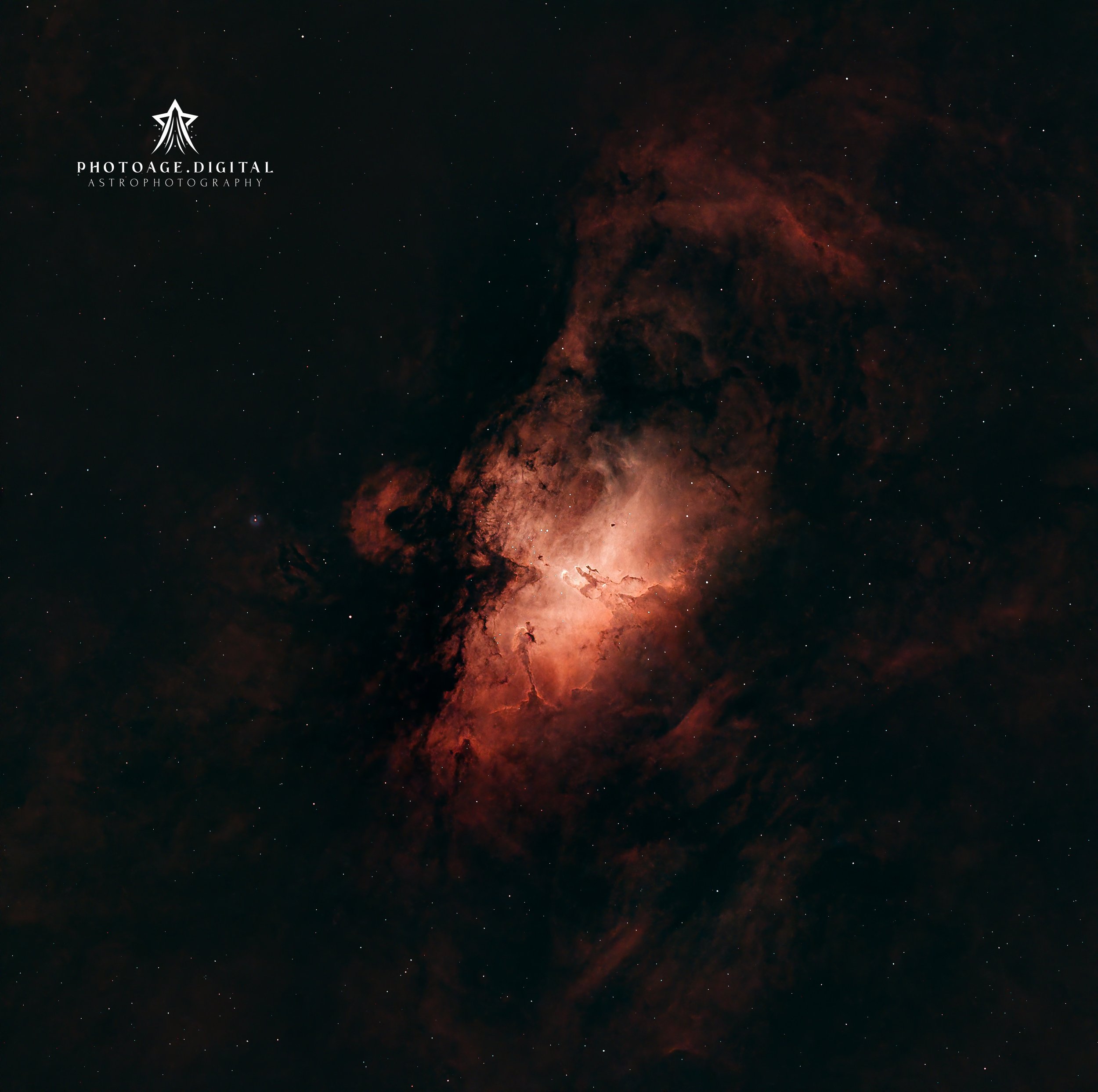 A space scene showing a nebula with red and orange hues, dotted with stars, and a logo in the top left corner that says 'Photoage Digital Astrophotography' with a star and rocket symbol.