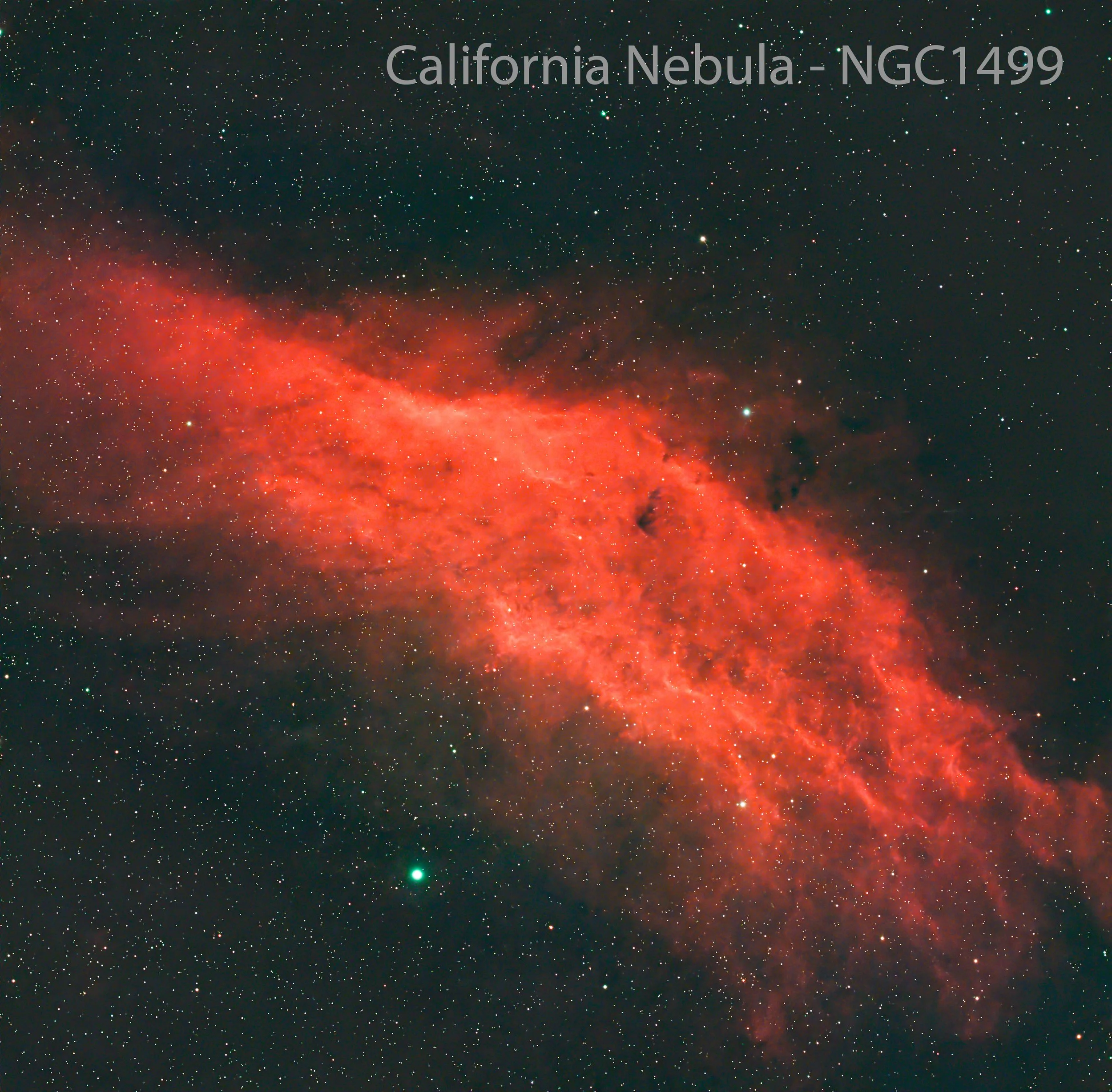 A section of the California Nebula, showcasing vibrant red and pink emission gas with numerous stars scattered throughout the dark space.