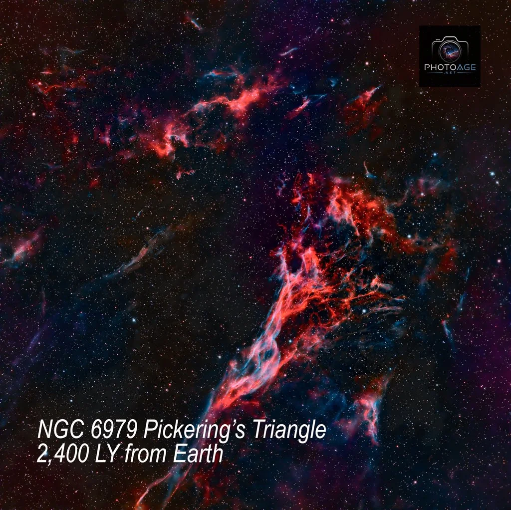 An image of a colorful, detailed nebula in space with numerous stars scattered around. There is text overlay that reads: "NGC 6979 Pickering's Triangle 2,400 LY from Earth." A logo in the top right corner features a camera icon with the text "PHOTOAG