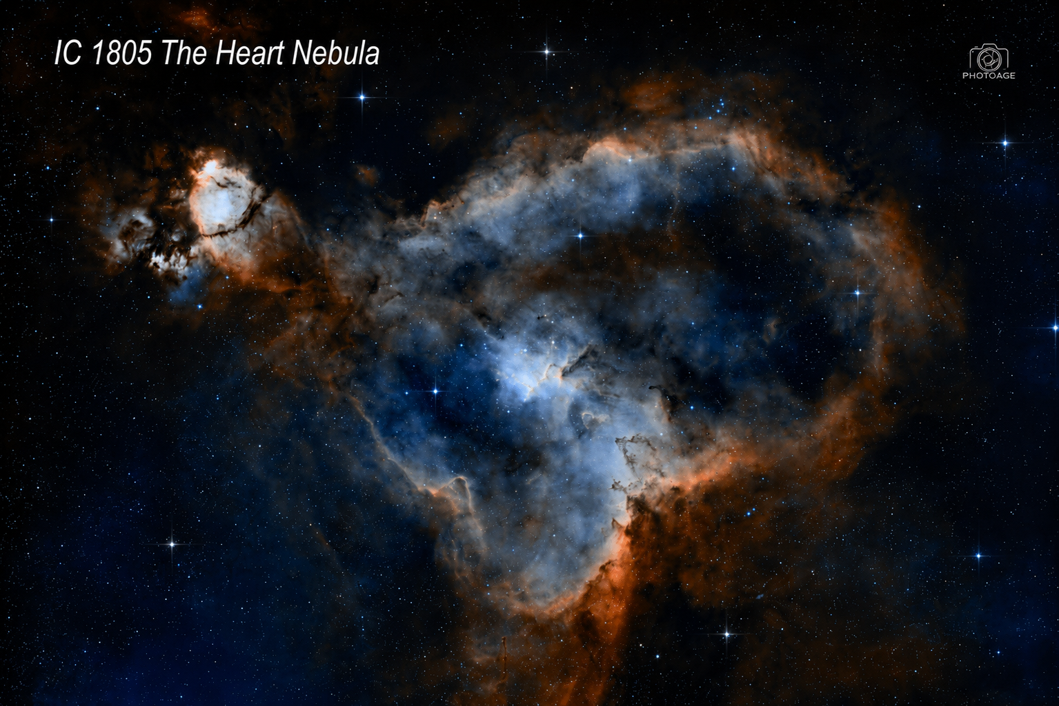 Image of the Heart Nebula, IC 1805, showing a colorful cloud of gas and dust in space with stars scattered throughout.