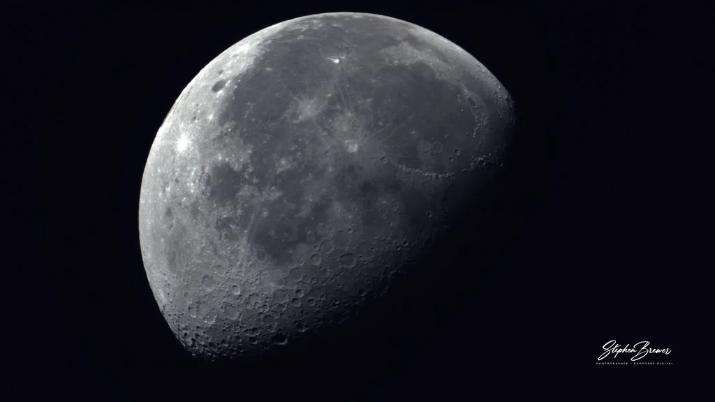Close-up photograph of the moon showing detailed surface craters and shadows.