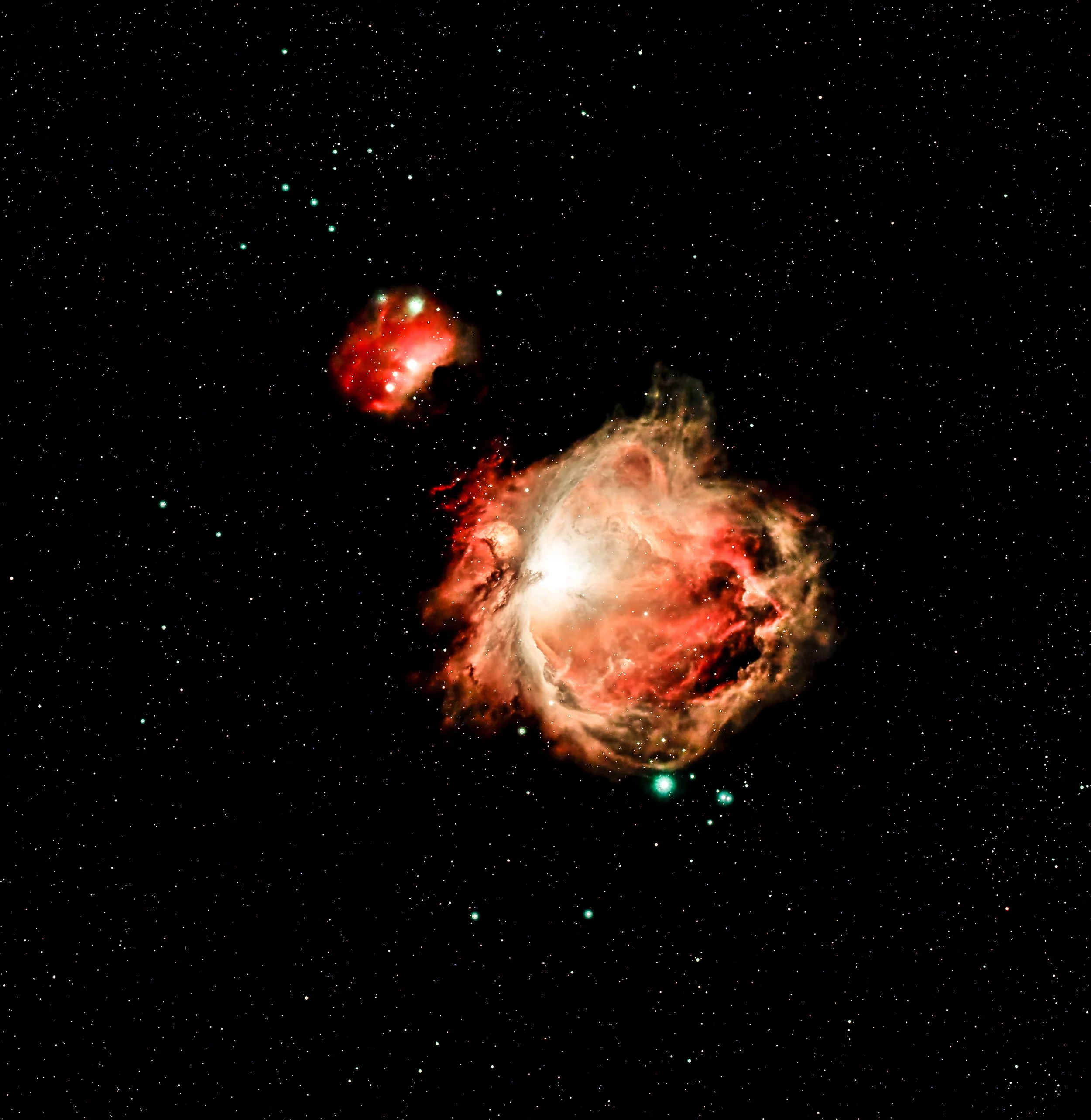 Deep space image showing stars, a nebula with bright red and orange gases, and a cluster of bright stars near the nebula.