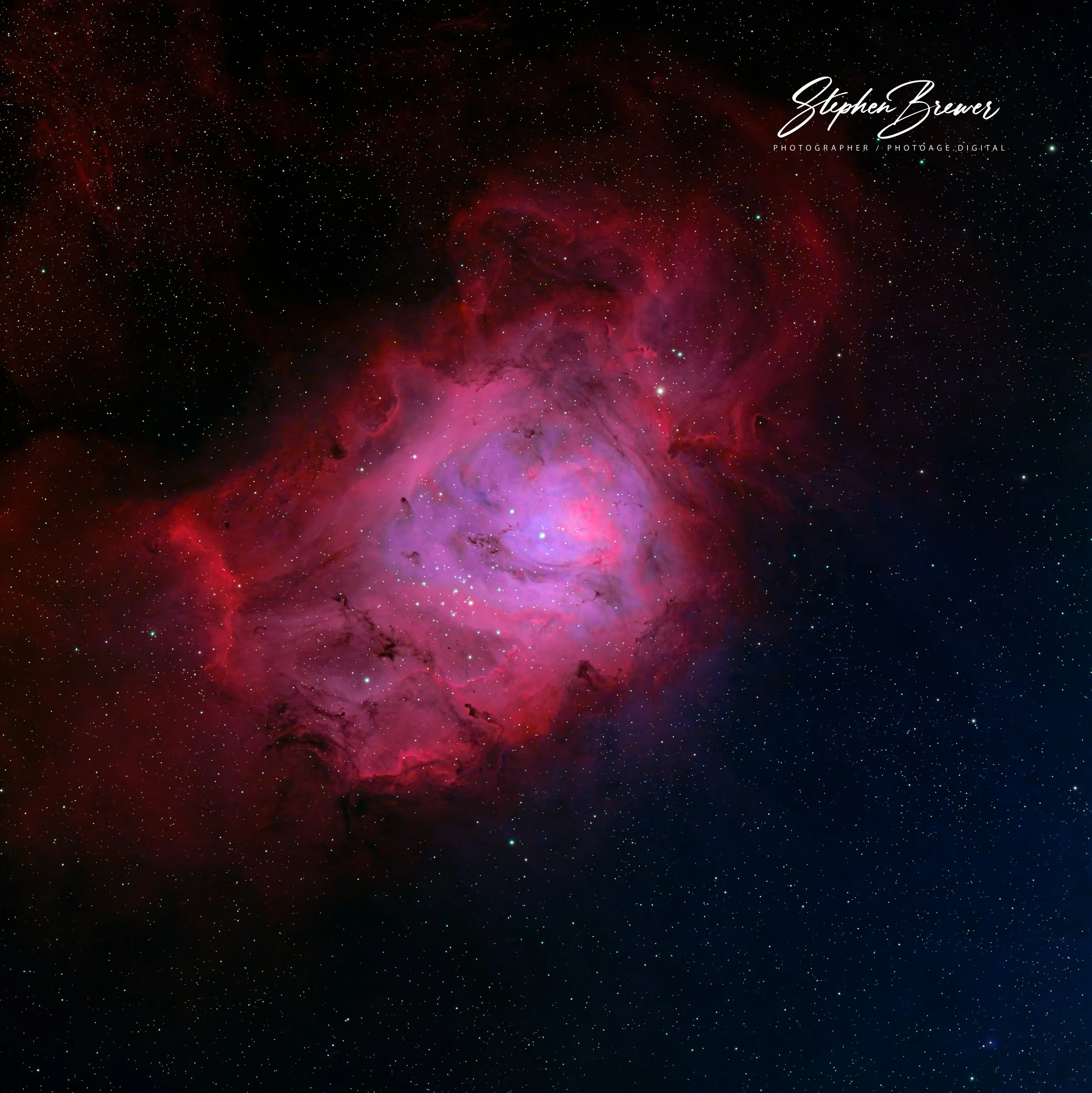 Deep space scene with numerous stars and a bright nebula in shades of pink and purple.