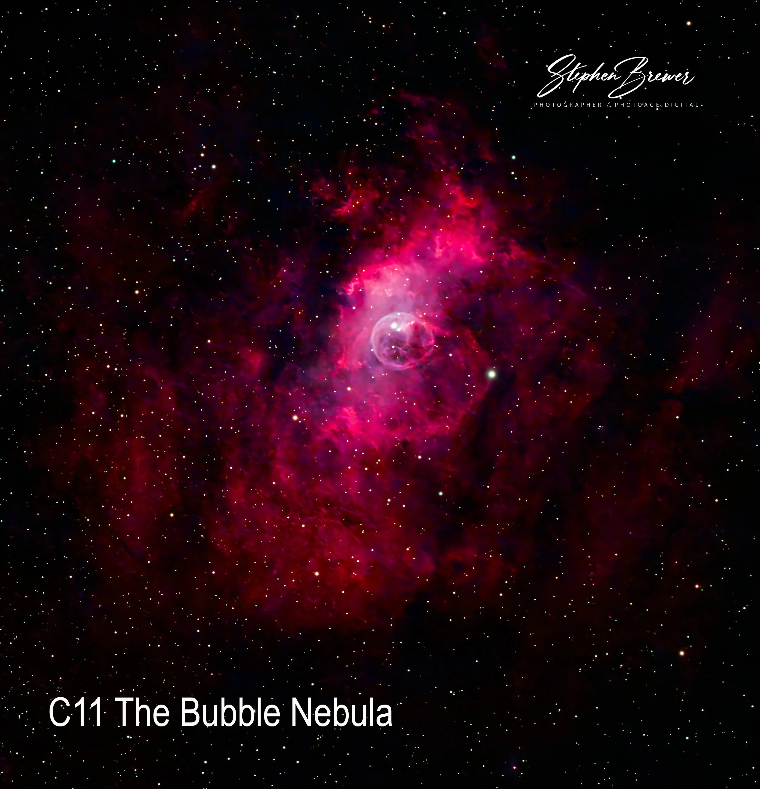 A deep space view of the Bubble Nebula with stars scattered across the black background, and a glowing pinkish-red nebula forming a bubble shape in the center. Text on the image reads 'C11 The Bubble Nebula' and a signature 'Stephen Brewer' in the up