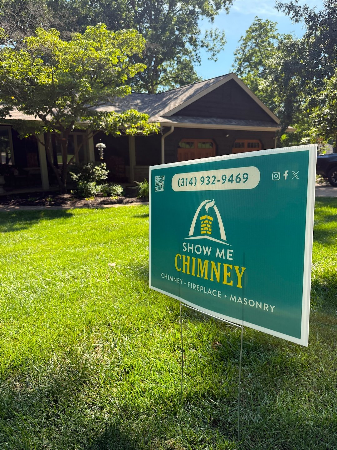 Show Me Chimney Sign in a green lawn outside a ranch home in Chesterfield, MO