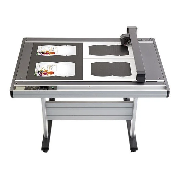 A flatbed plotter cutter machine for cutting cartons and labels.