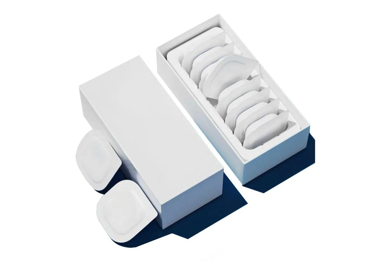 A white box of individual packets containing medical ointments.