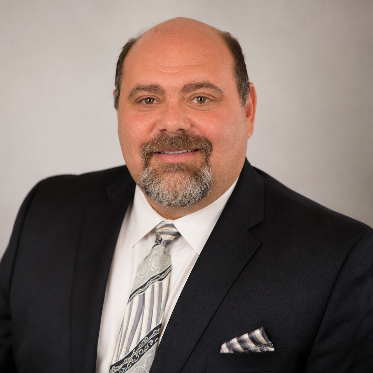 Professional headshot of Larry Policastro, owner of Hillside Associates, a tax preparation and accounting firm.