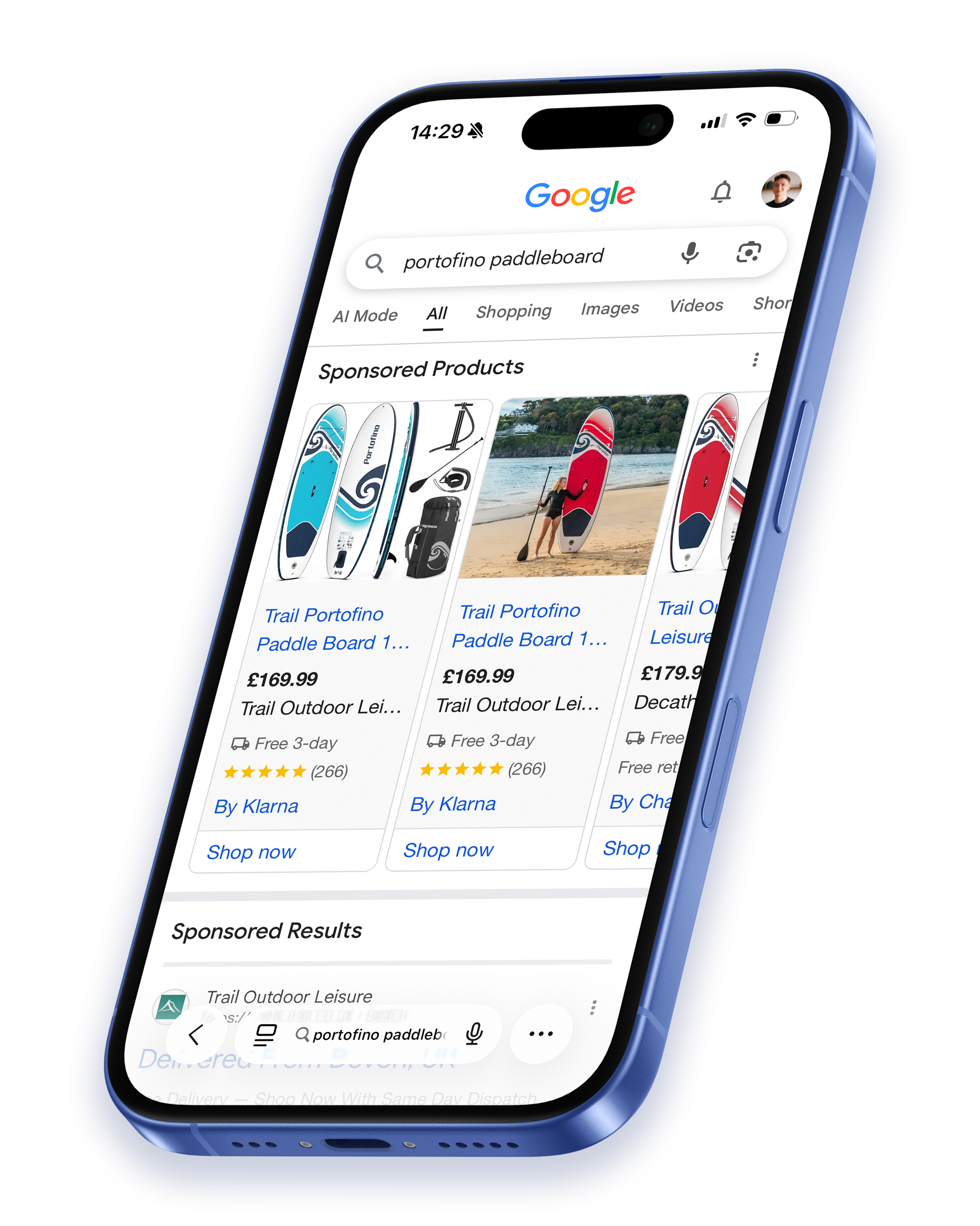 Smartphone displaying Google search results for 'portofino paddleboard' with sponsored paddleboards listed and a photo of a person holding a paddleboard on a beach.