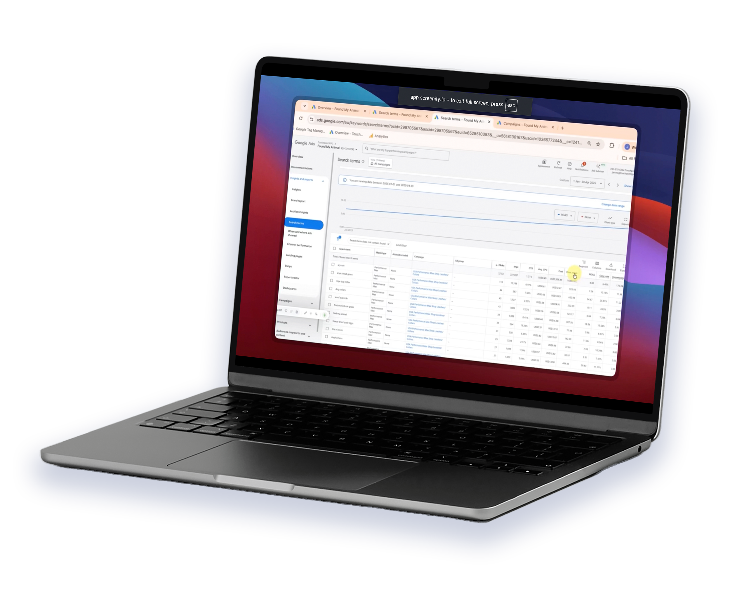 A laptop displaying a digital marketing analytics dashboard with graphs and search data.