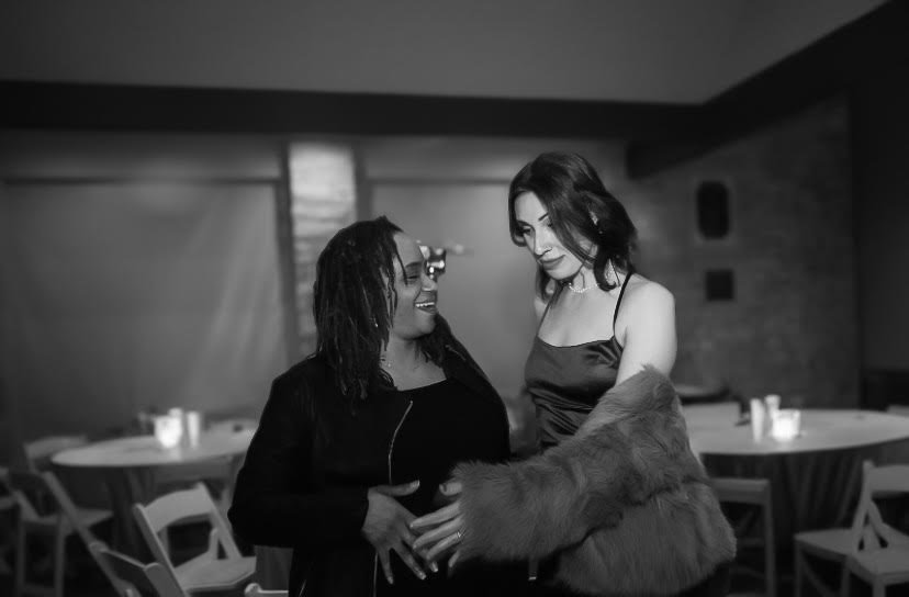 Inclusive prenatal feeding preparation session for expecting parents in Chicago. Clinical lactation specialist assisting parents with pump fitting and milk supply strategy