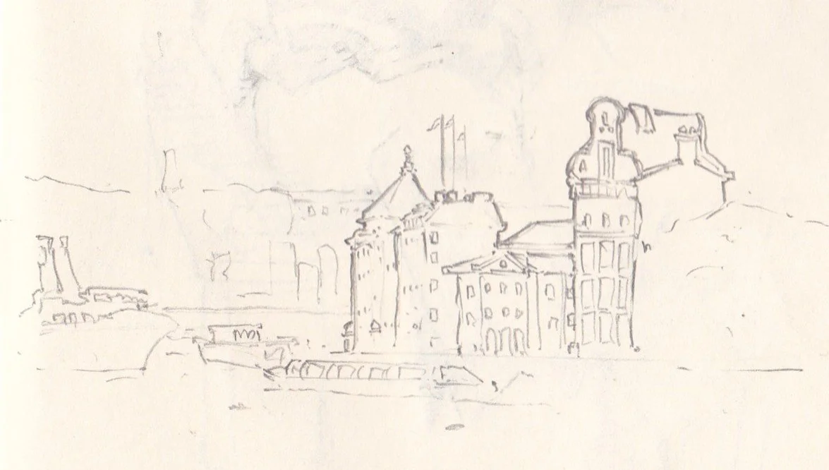 A simple pencil sketch of a cityscape with multiple buildings, some with turrets and rooftops, suggesting a European or historic town.