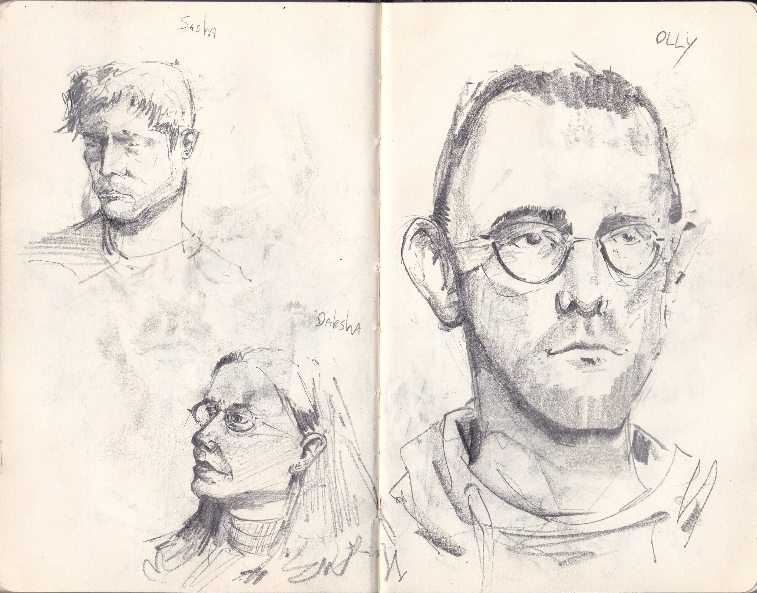A sketchbook spread with four pencil sketches of people's faces, some with glasses, and handwritten names Sasha and Olly.