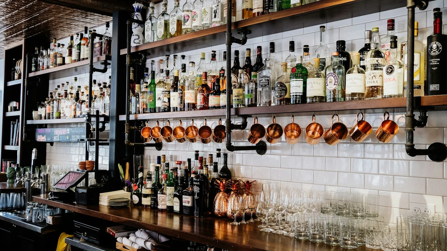 Spirits displayed on a back bar. New York liquor and spirits retail