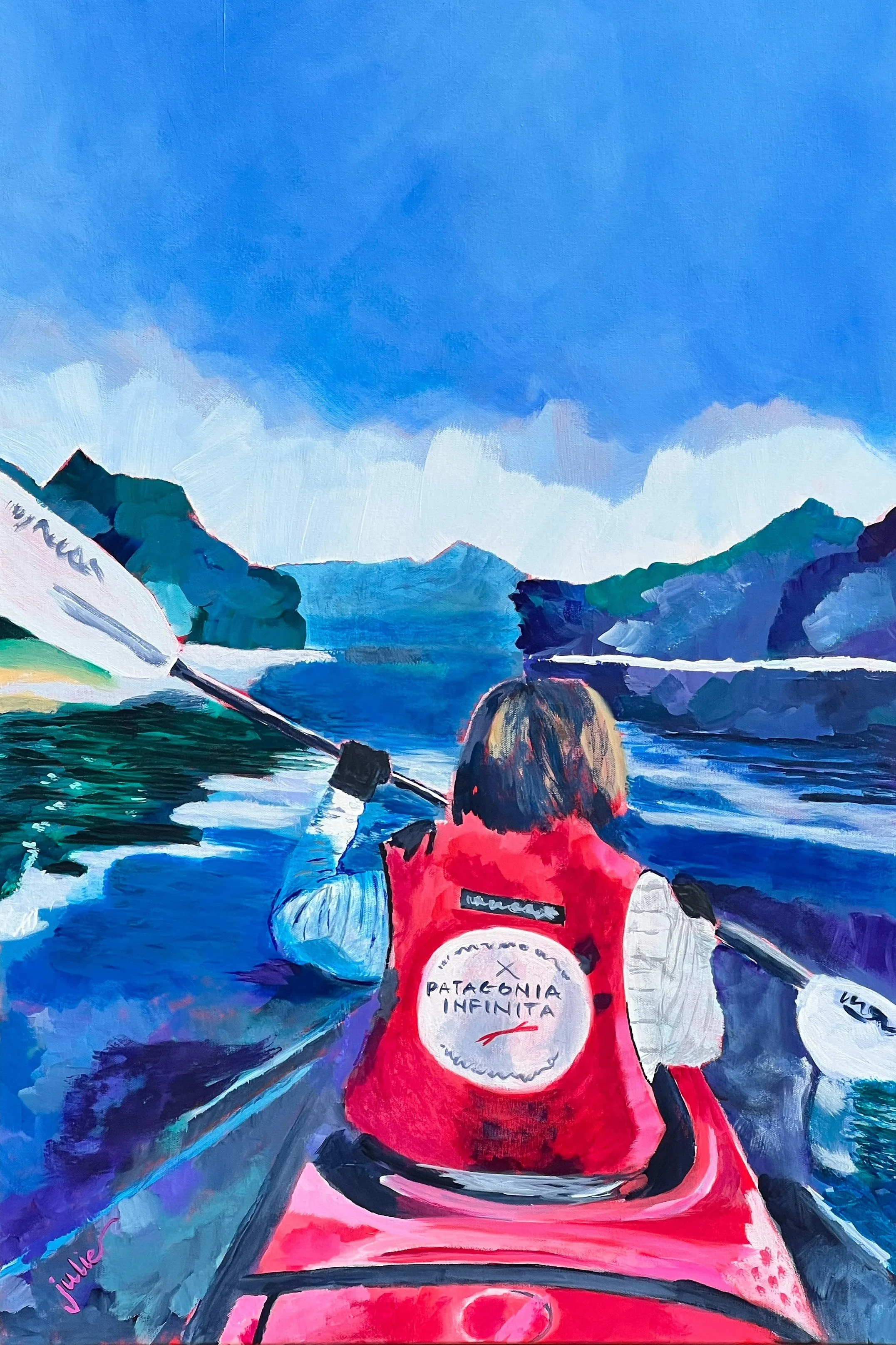 Painting depicts a scene of a woman kayaking on a lake with scenic mountain and forest background under a blue sky.