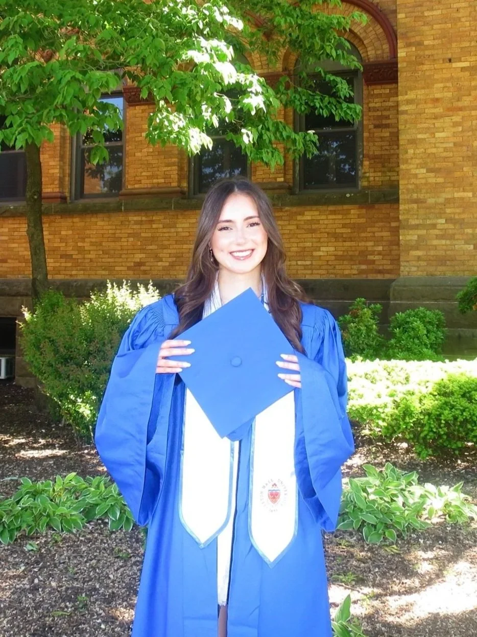 Graduation portrait of Amalia Santos in her cap and gown.