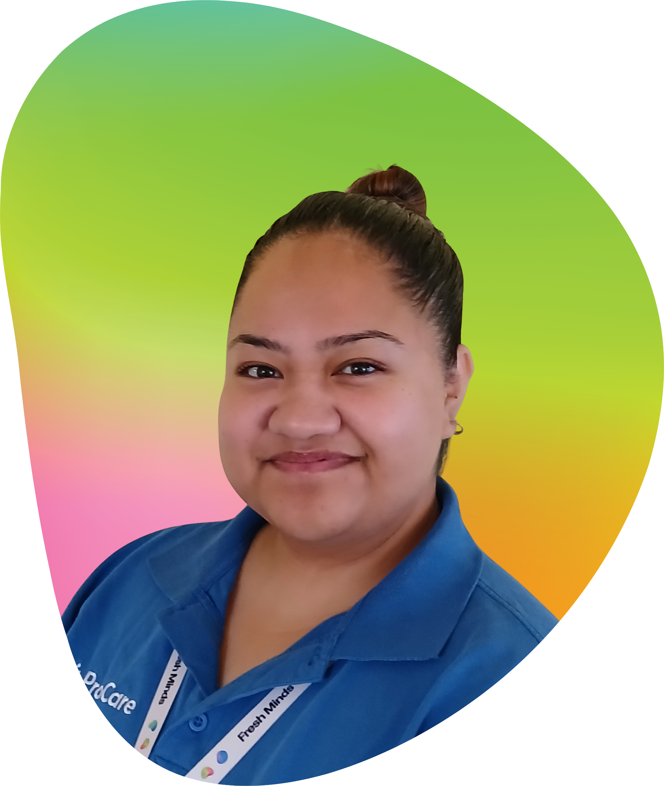 Close-up of a woman with dark hair tied in a bun, wearing a blue uniform and a white lanyard with text, against a background with gradient of pastel colors from pink to green to yellow to orange.