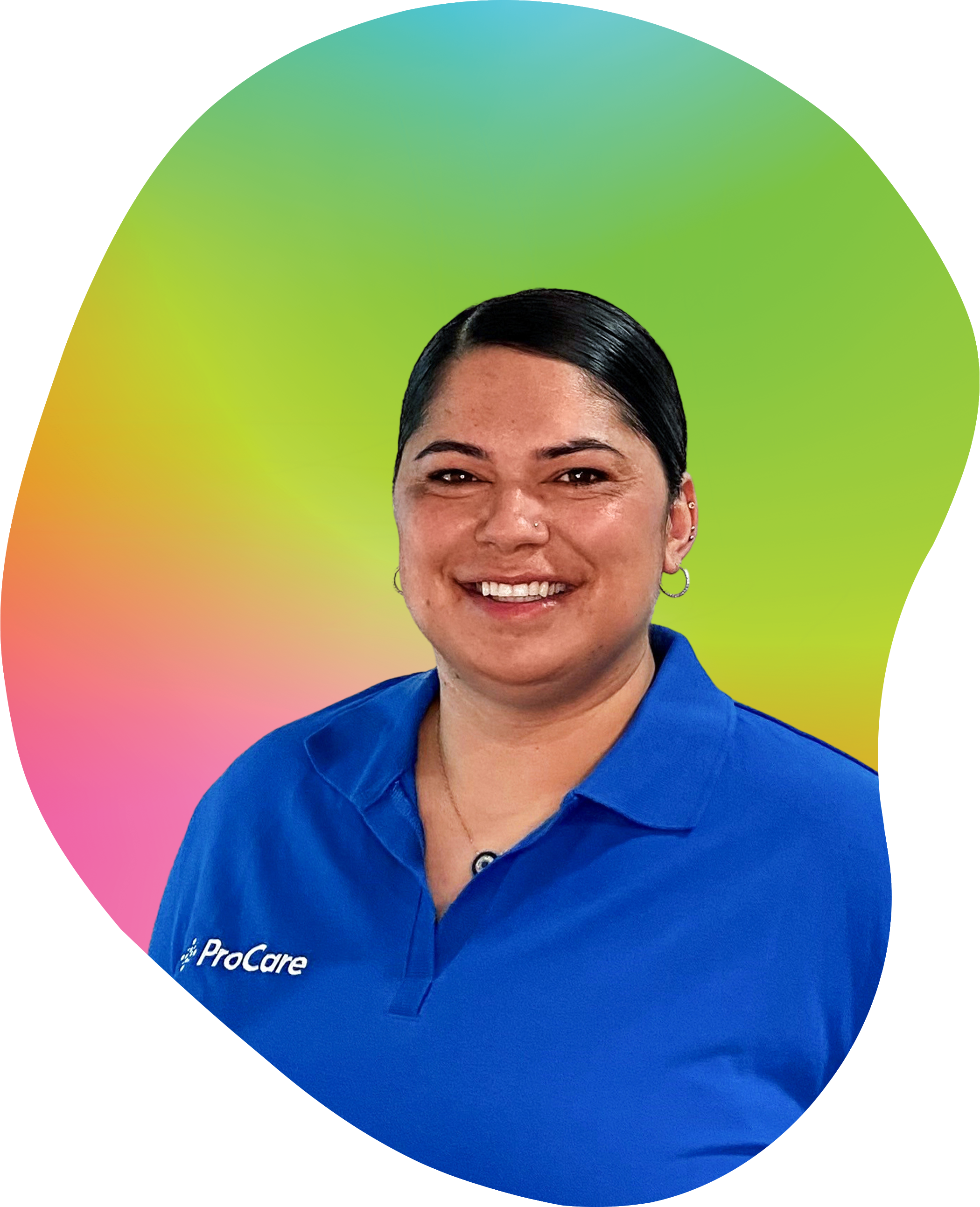 A woman with dark hair tied back, smiling, wearing a blue polo shirt with a 'ProCare' logo, standing in front of a vibrant, rainbow-colored background.