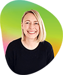 Portrait of a smiling woman with shoulder-length blonde hair, wearing a black top, against a colorful circular gradient background.