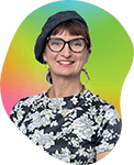 A woman with short dark hair, glasses, and a floral top, smiling against a vibrant, multicolored background.
