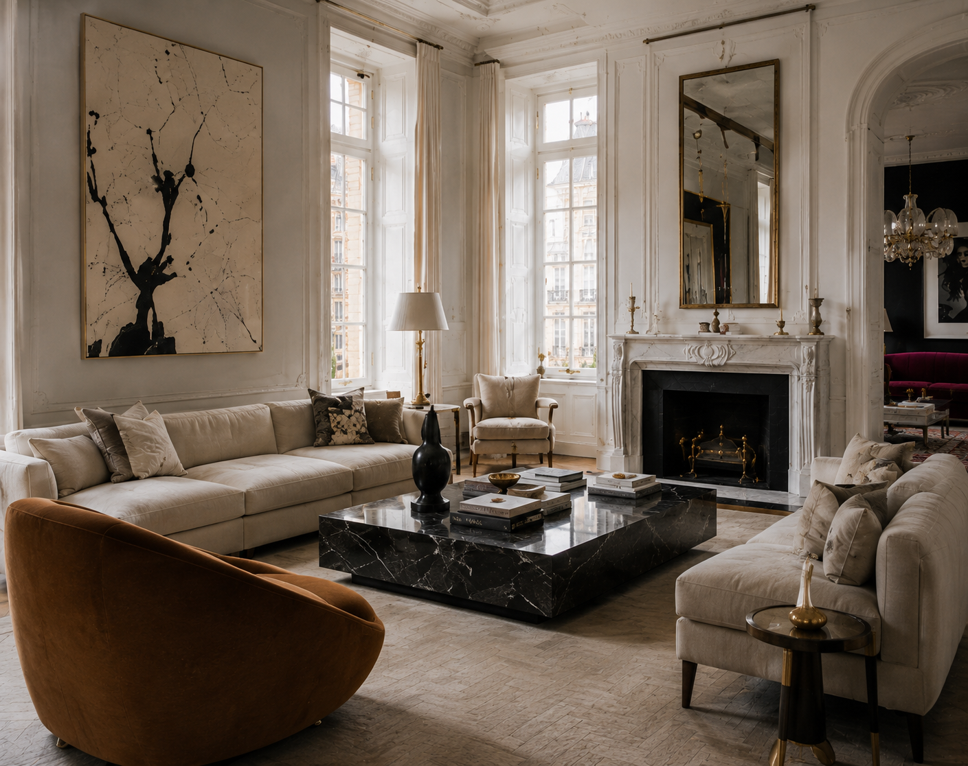 Light-filled living room with cream seating, marble fireplace, dark coffee table, and tall windows.