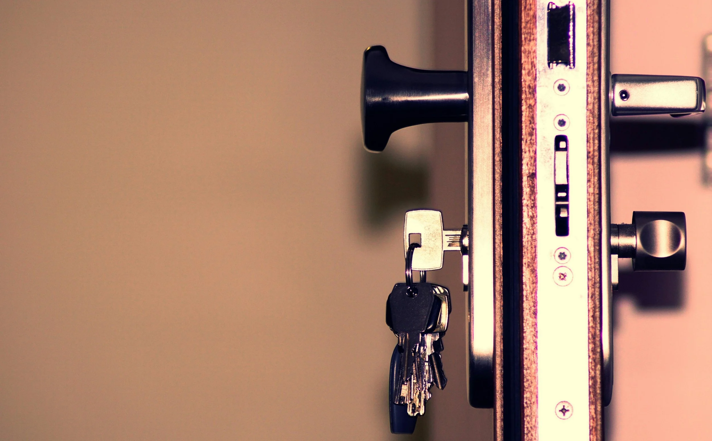 Close-up of a set of keys in a door lock