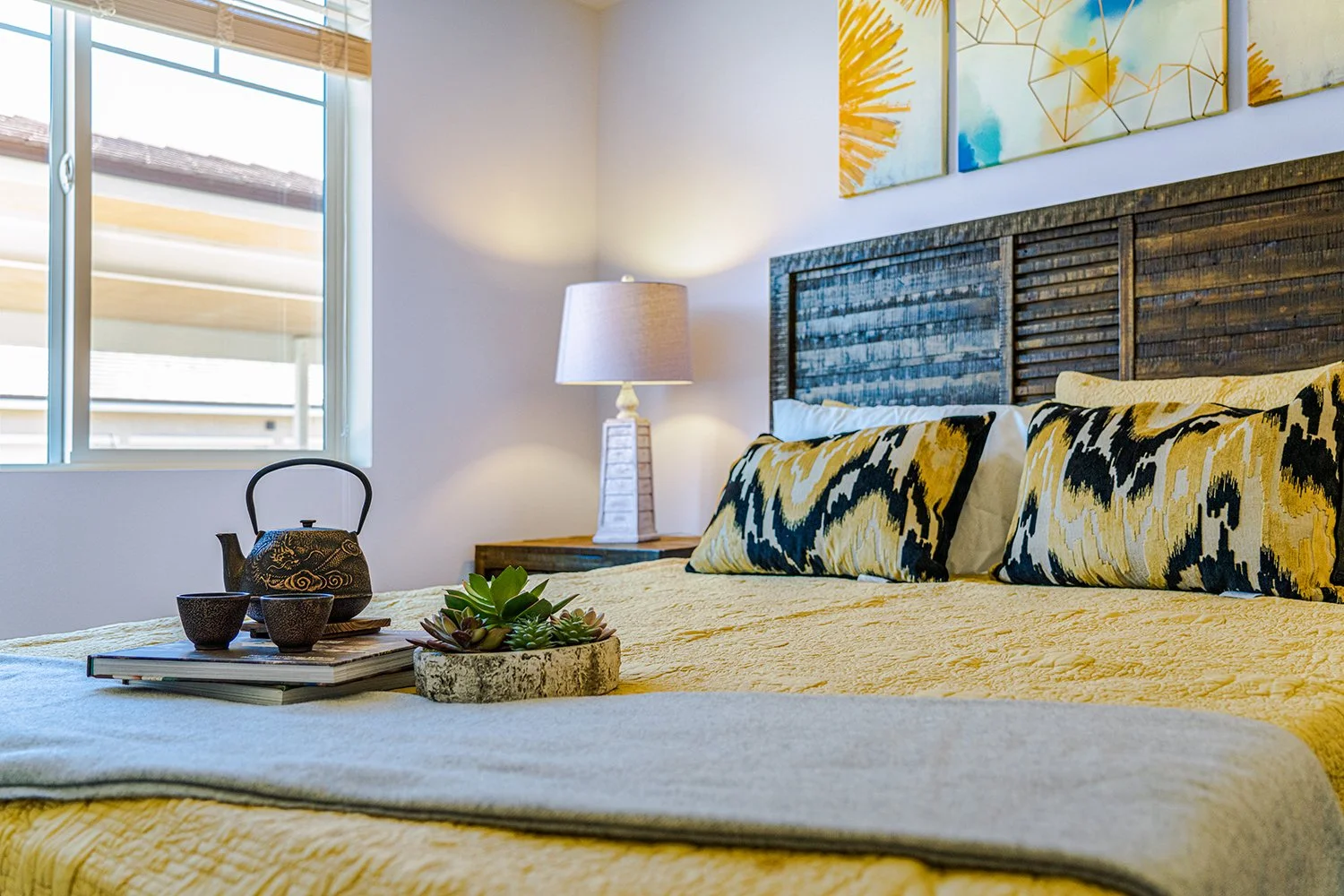 Bedroom in Turtle Creek apartment home with carpeted flooring and large window allowing for gorgeous natural lighting in the bedroom. 