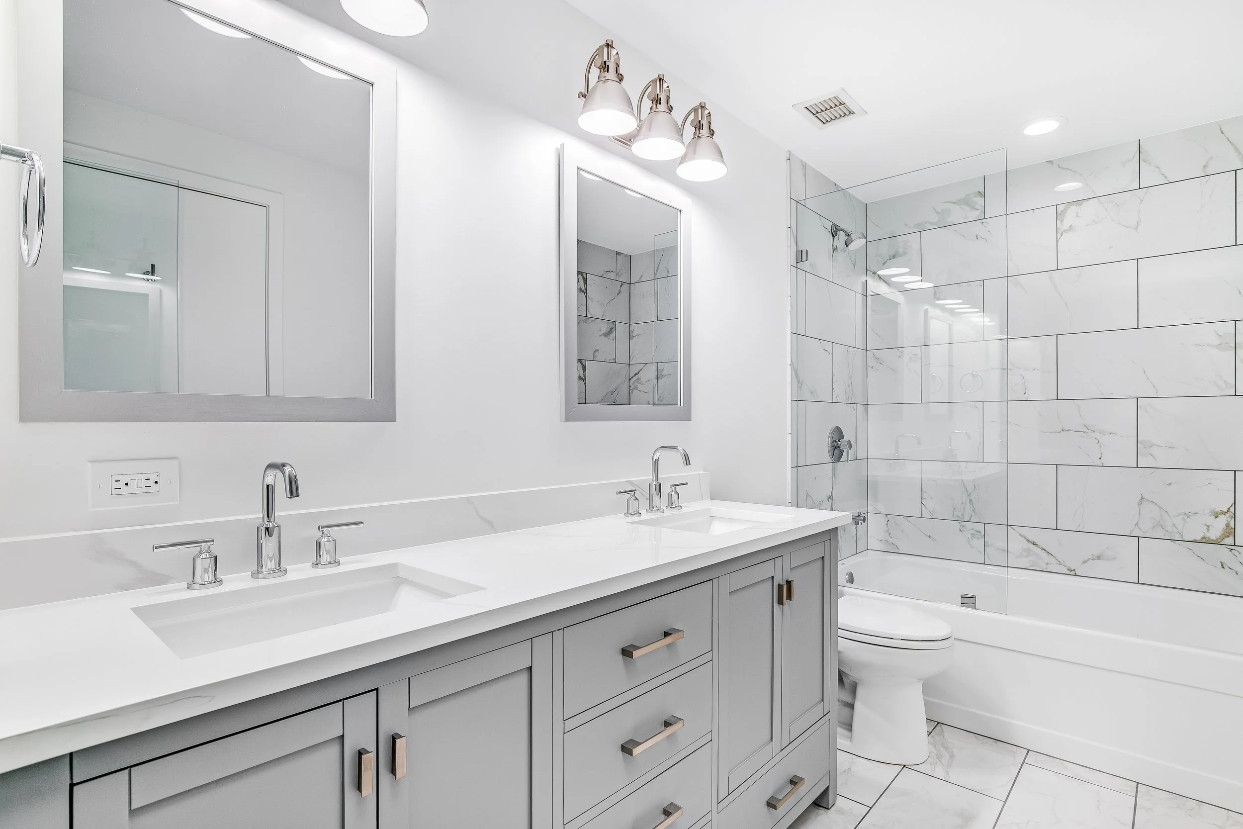 Modern master bathroom renovation in Phoenix Metro featuring custom tile work and luxury vanity