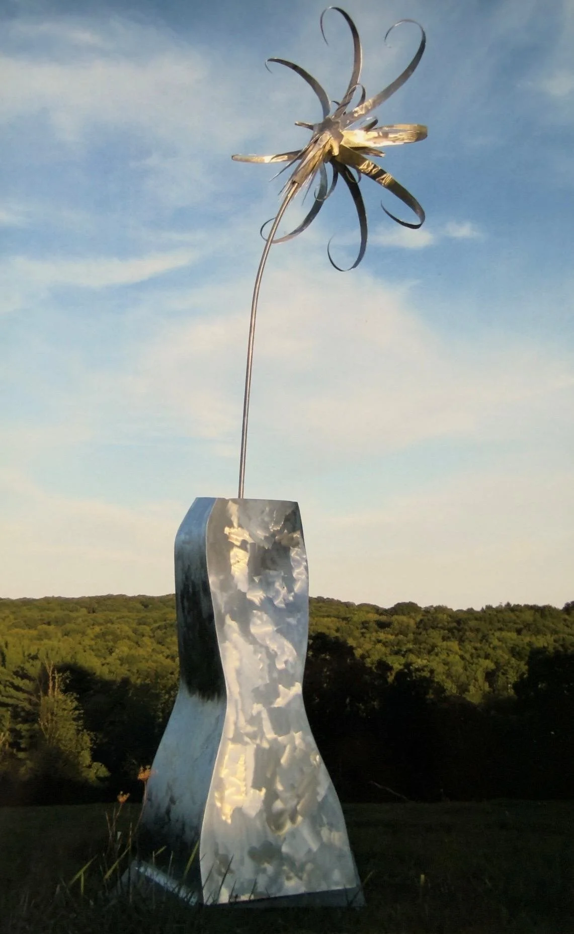 Giant flower (lily) in a 6' tall bud vase; welded aluminum; Garrison, NY