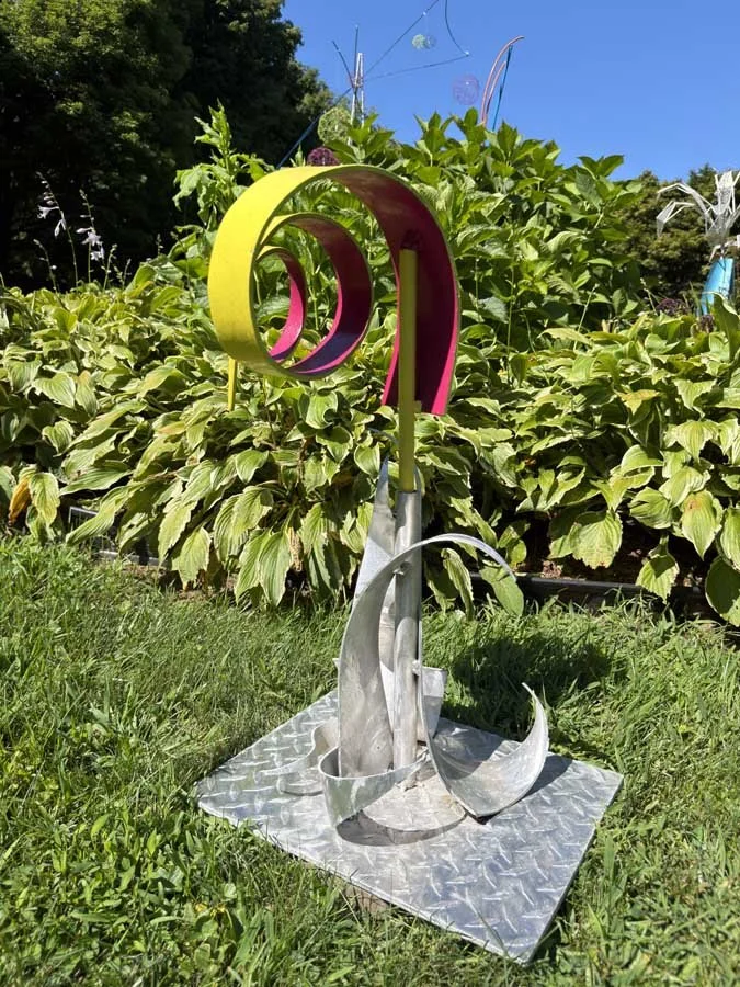 Yellow and Violet Energy Spiral | Hand-Curved Aluminum Sculpture by Jodi Carlson