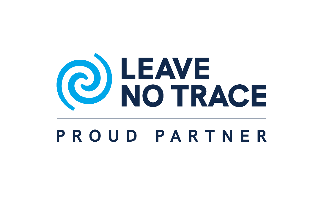 Logo for Leave No Trace featuring a blue spiral symbol and the text "Leave No Trace" with the tagline "Proud Partner" beneath.