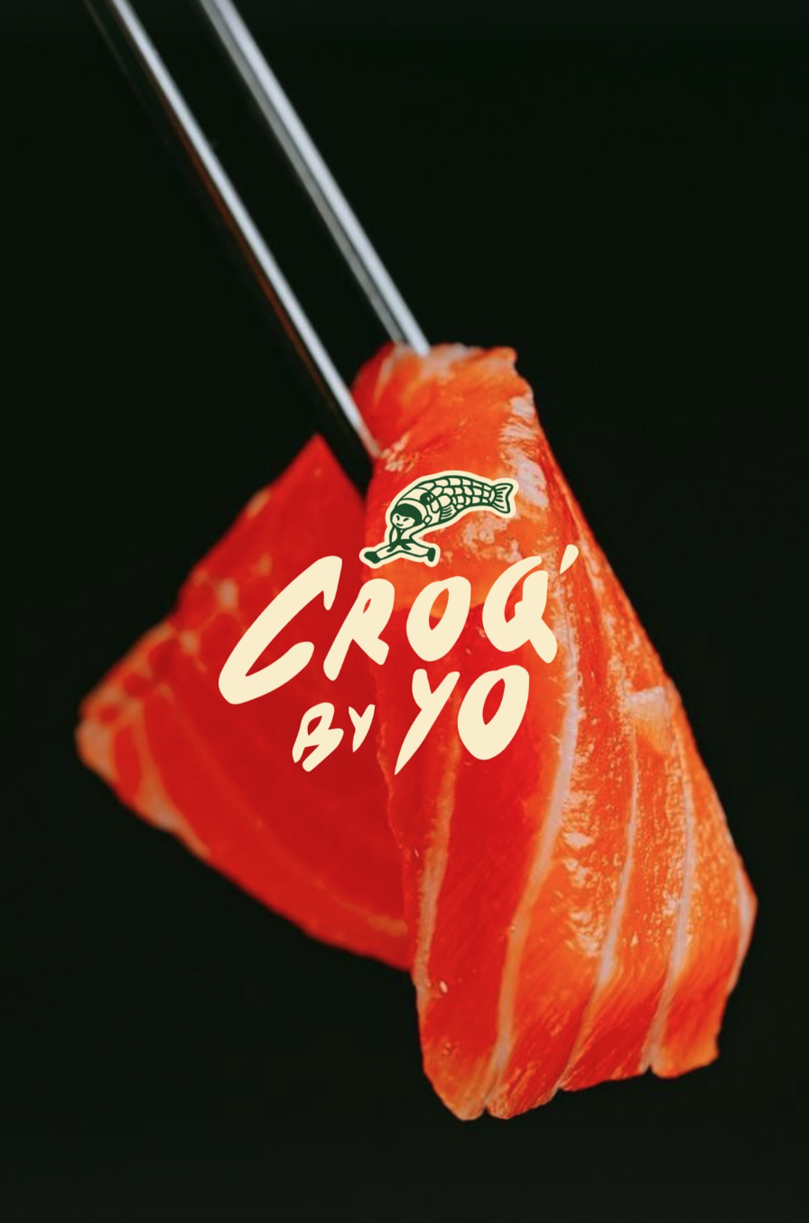 A piece of raw salmon with a logo and text overlay, showing a fish and the words 'CROQ BY YO' on a black background.