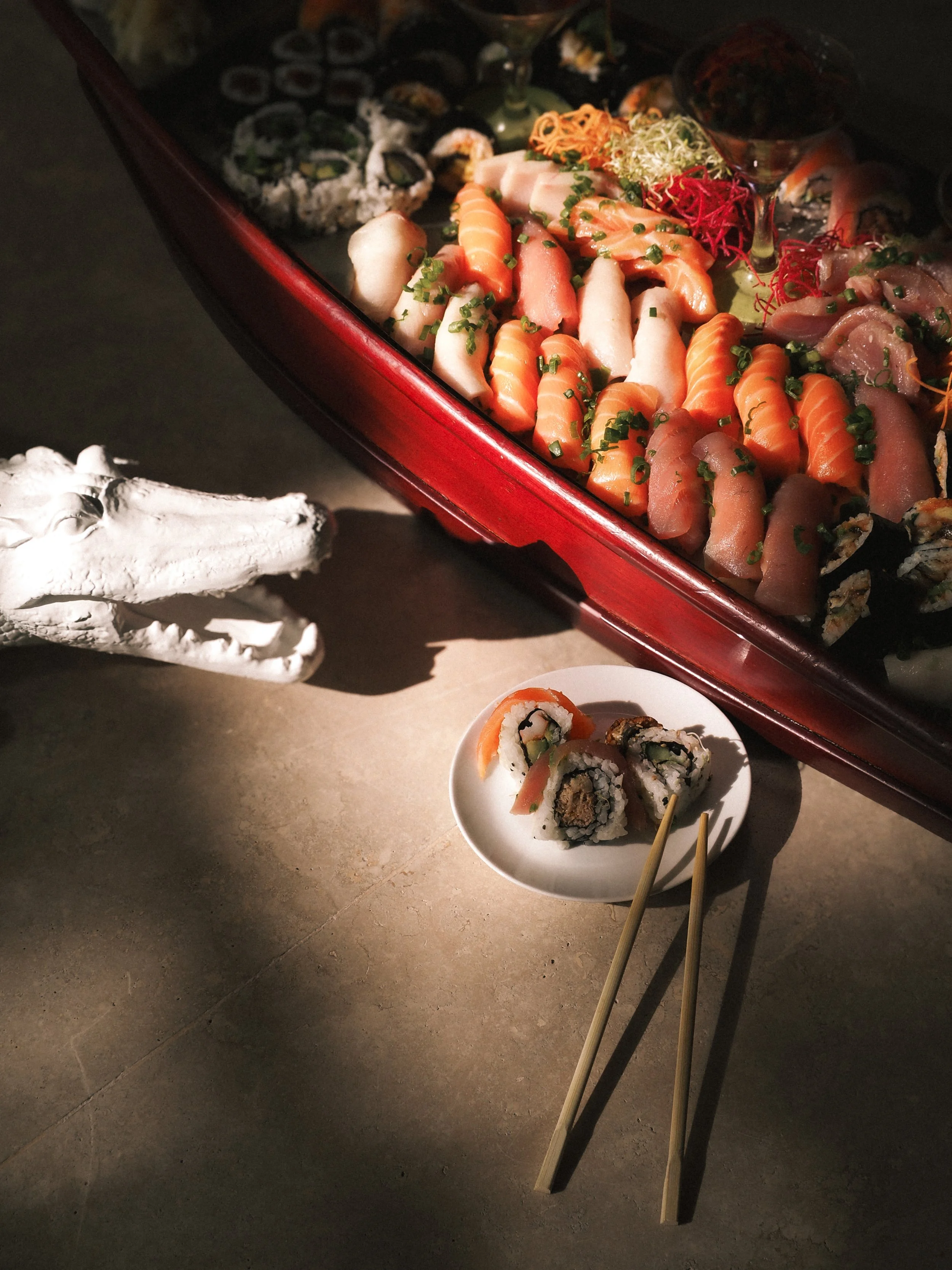 Assorted sushi and sashimi boat and platter by Croq by Yo in St. Barths