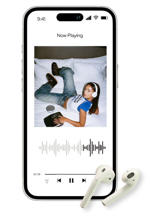 A woman lying on a bed with headphones on, holding a smartphone and wearing wireless earbuds, with an audio wave on the phone screen.