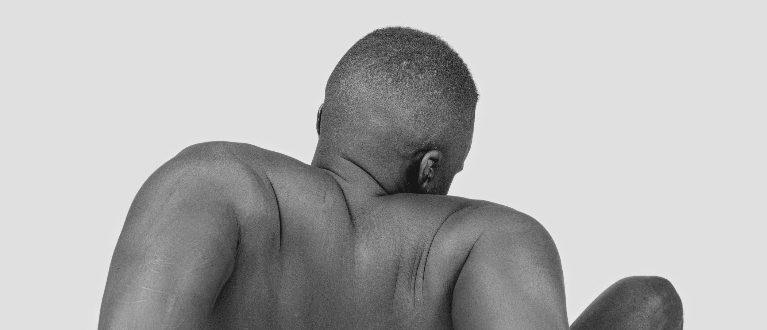 Back a a man facing away from the camera