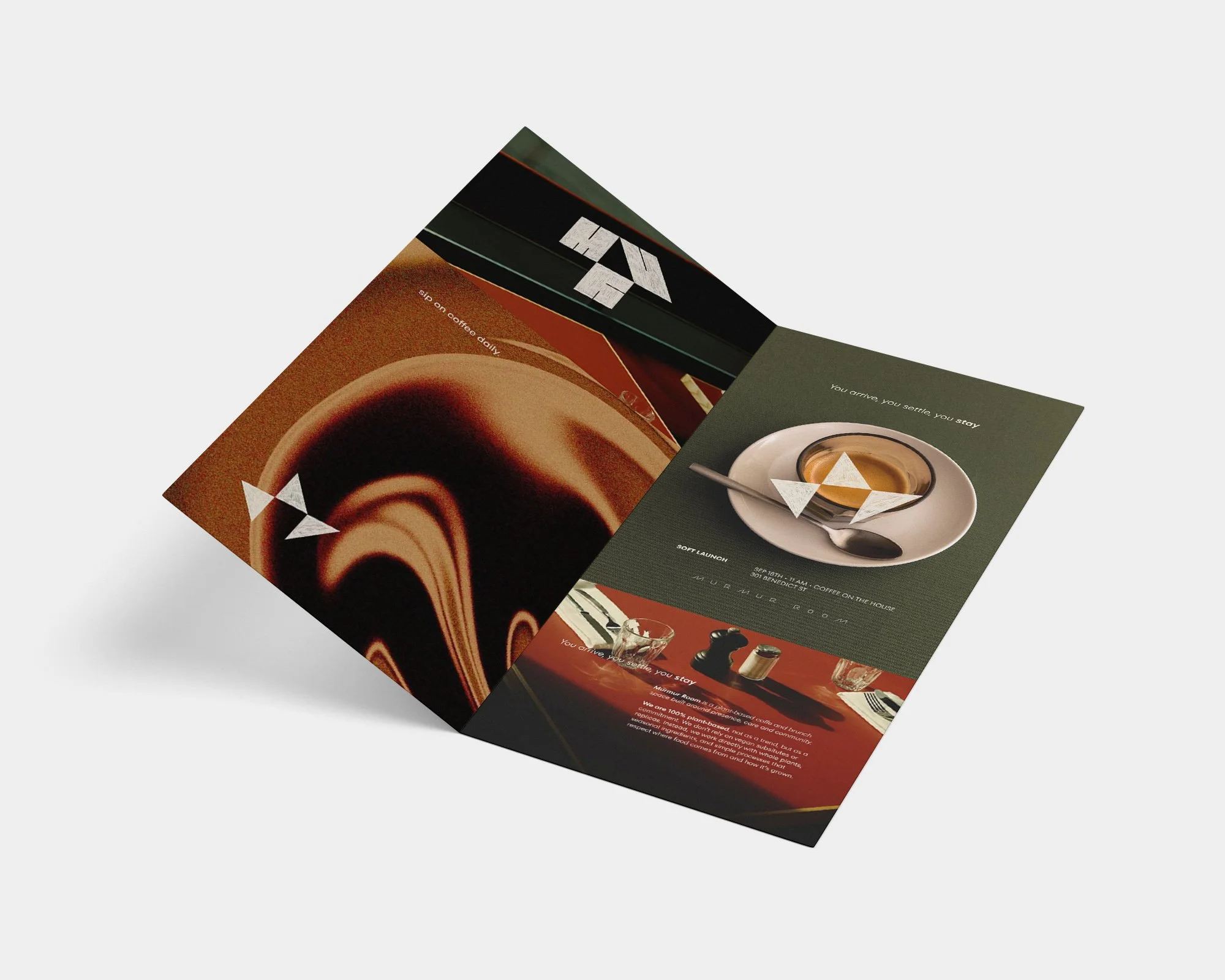 Folded coffee shop flyer featuring a cup of coffee with latte art, and promotional text about a coffee launch event.