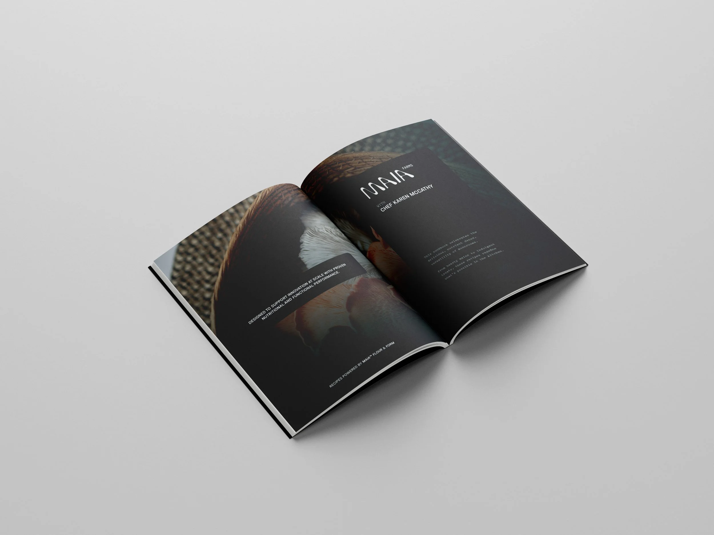 Open magazine on a plain light gray surface, showing pages with images and text about mushrooms and chef Karen McCarthy.