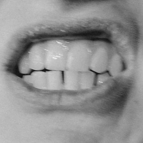 Extreme close-up of a man's teeth with mouth open