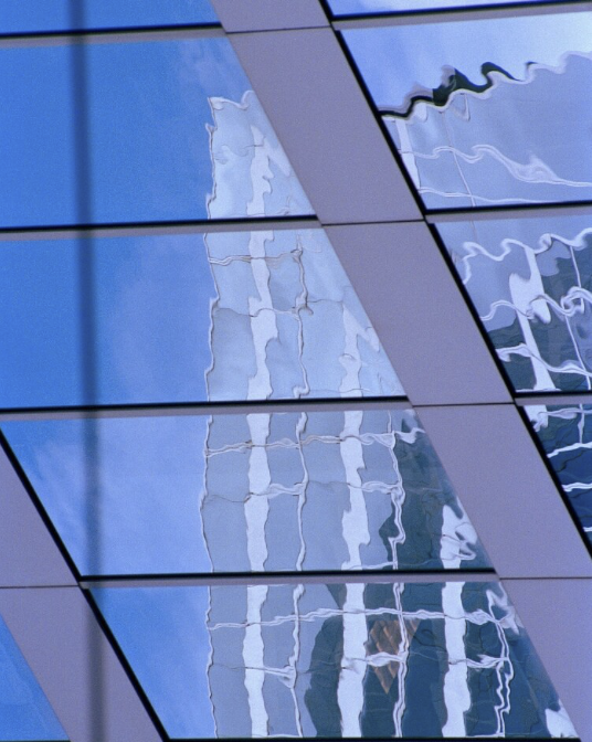 Distorted reflection of a building on windows