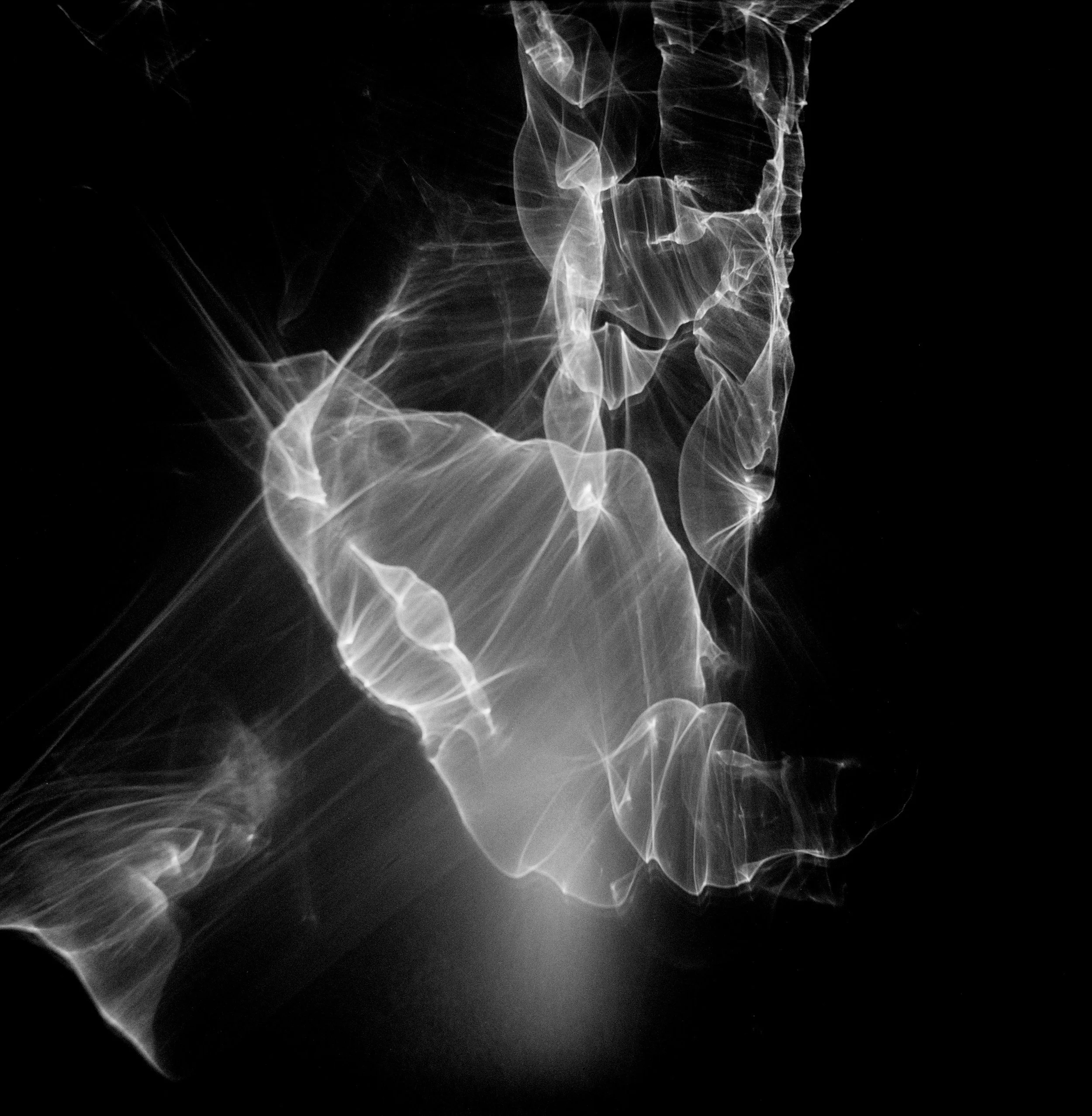 Black and white image of light reflections on a wall