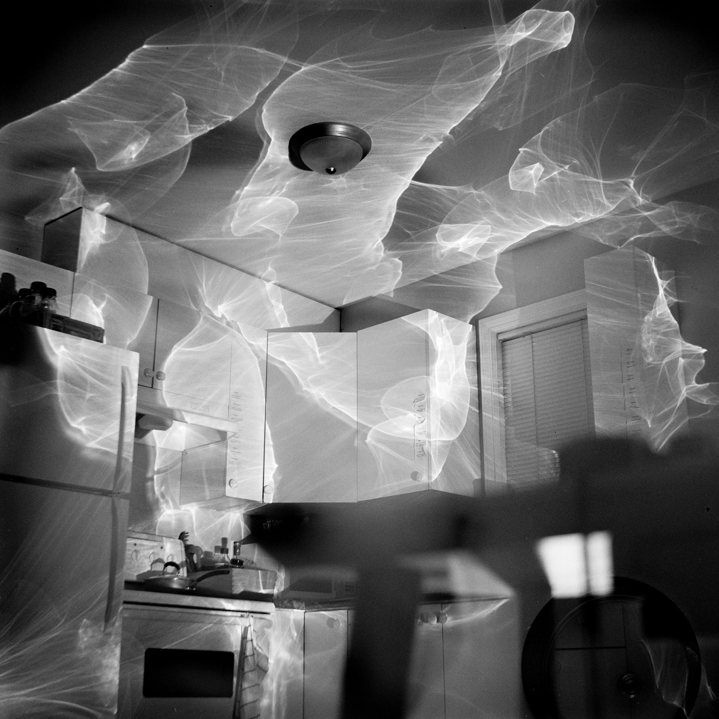 Black and white image of light reflections on a wall