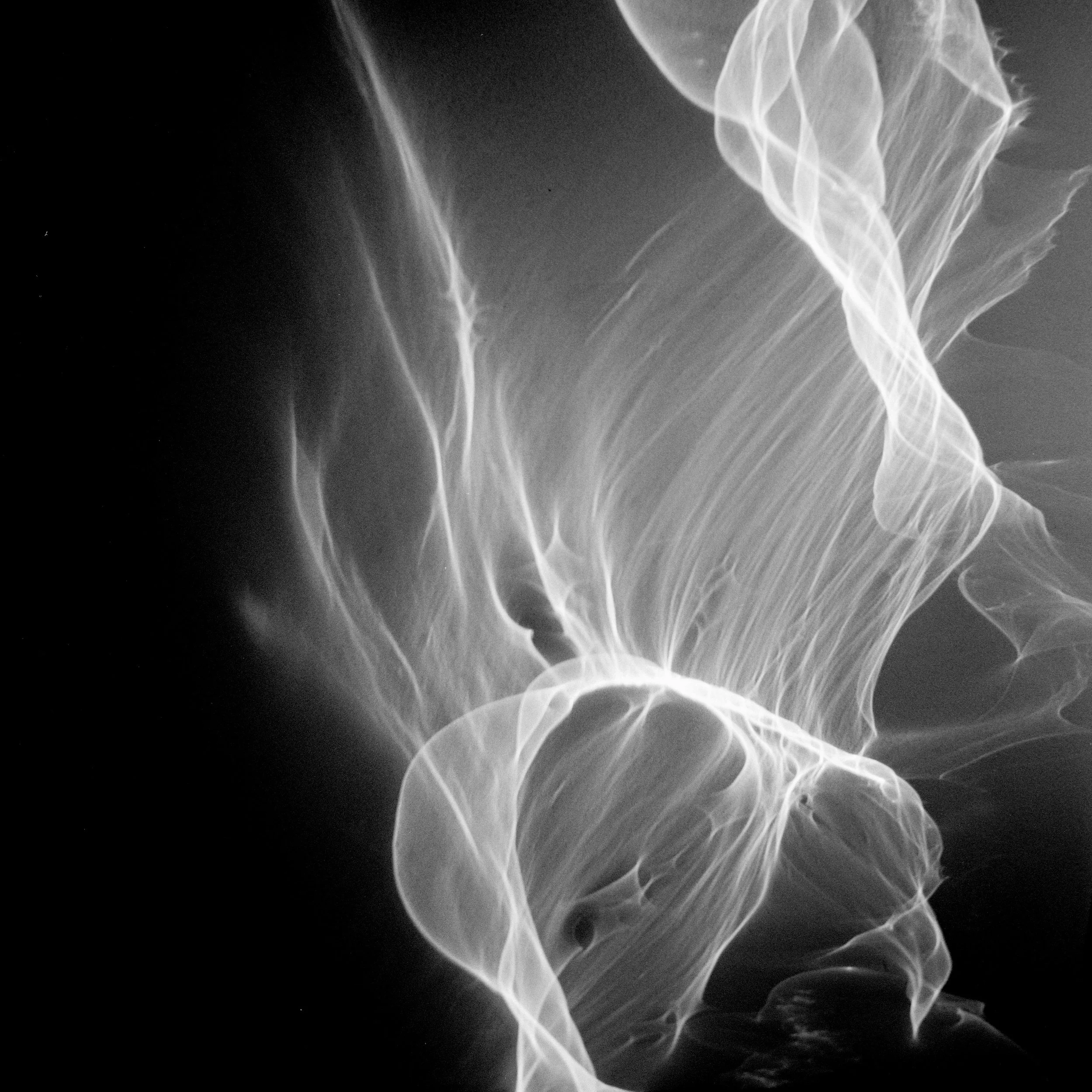 Black and white image of light reflections on a wall
